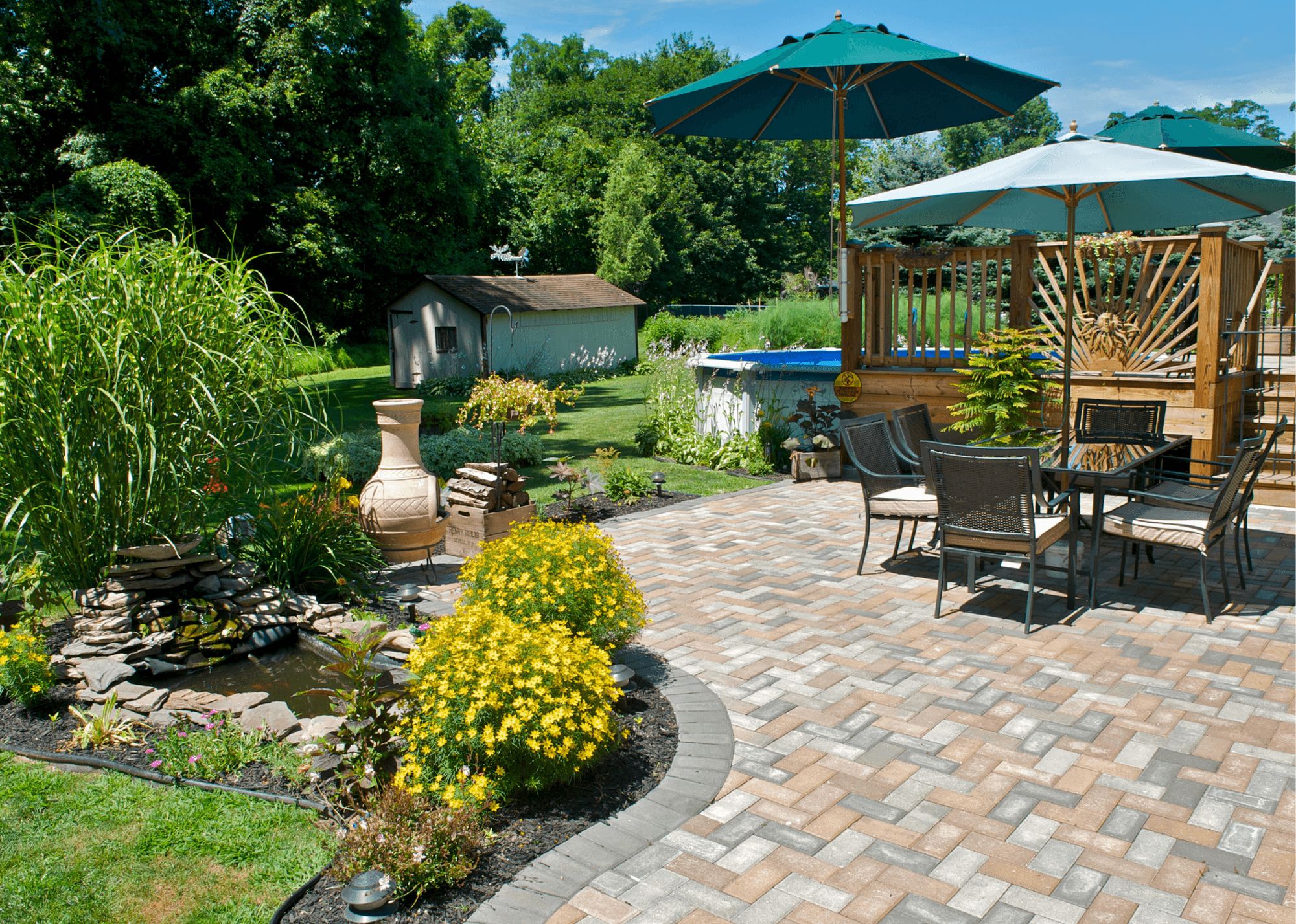 Backyard with patio pond and plant combos